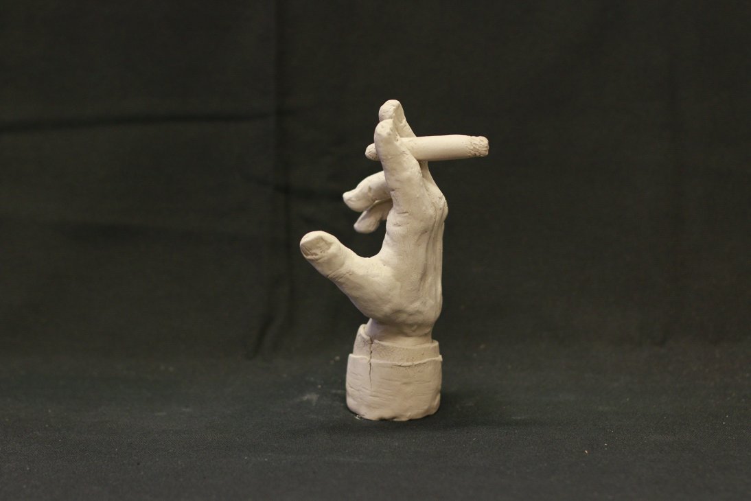 "Hand with cigar"