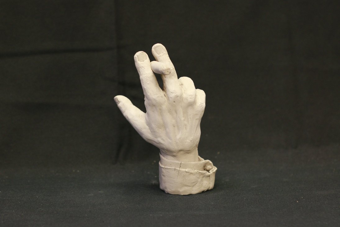 "hand with cigar"